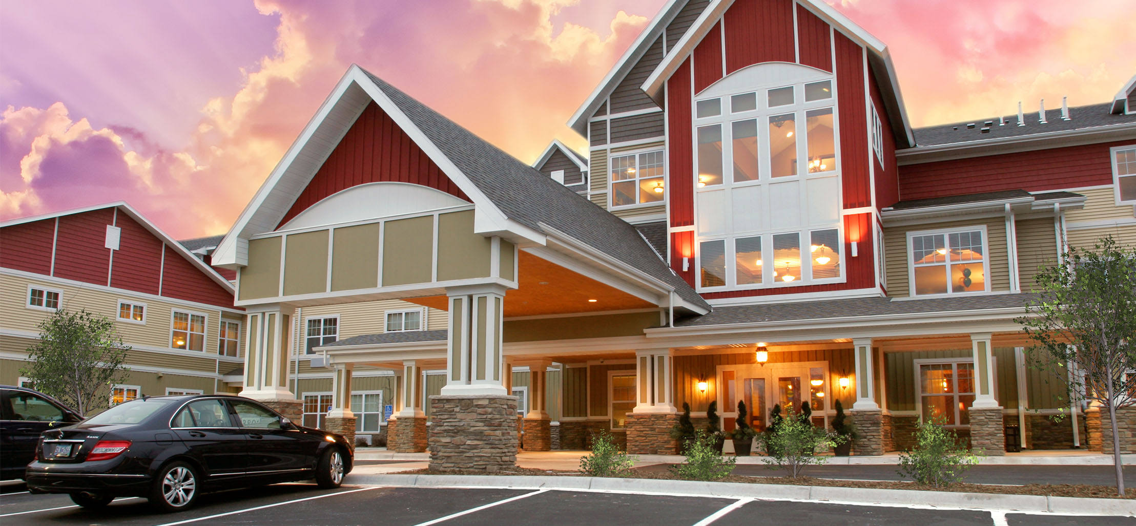 exterior of Columbia Heights facility with stone and dark red siding - New Perspective Careers Assisted Living Careers