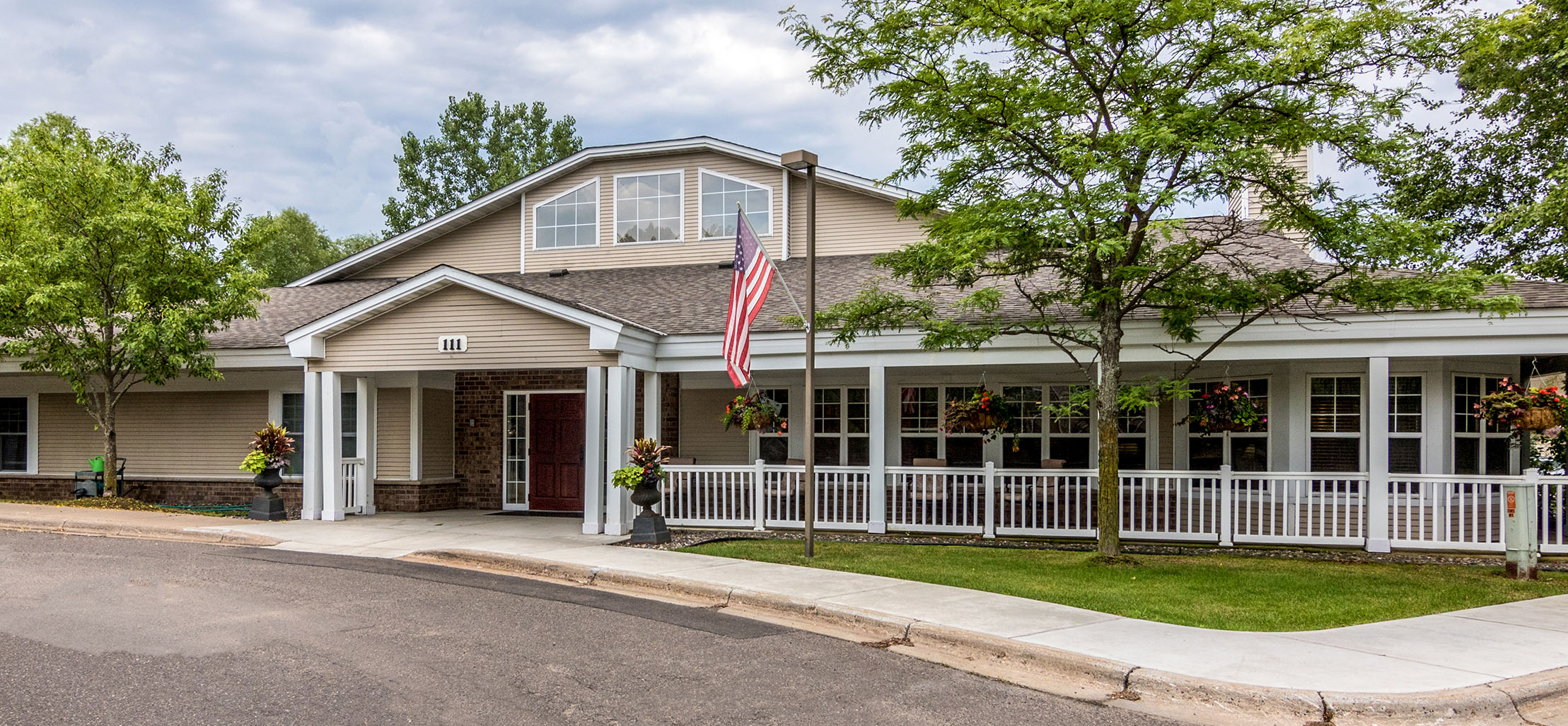 exterior of Mahtomedi facility with brick and light brown siding - New Perspective Careers Assisted Living Careers