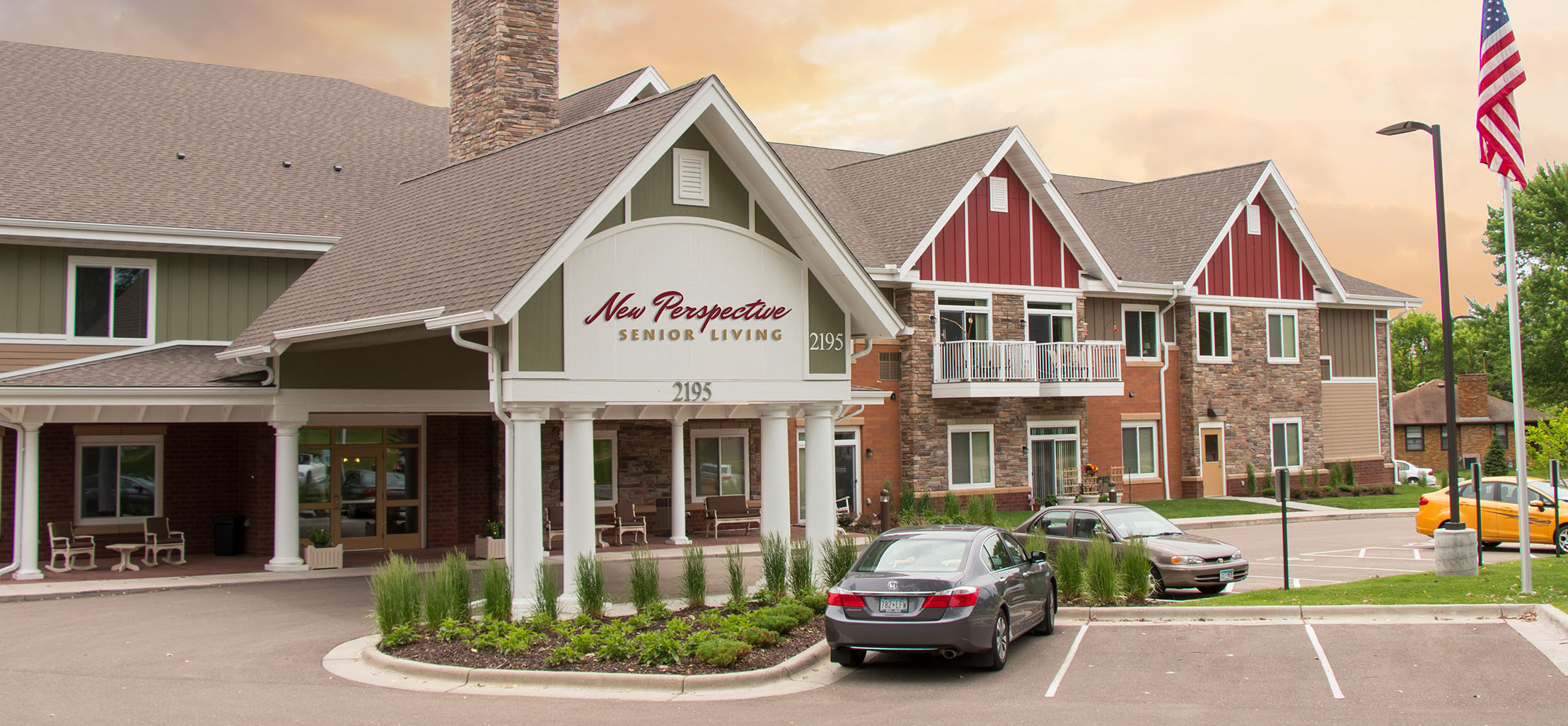 exterior of Woodbury facility with green and red siding - New Perspective Careers Assisted Living Careers