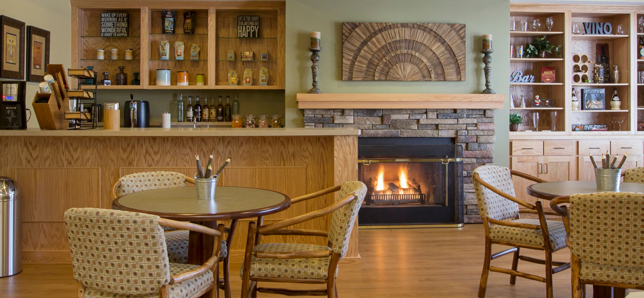 coffee bar area with a fireplace that has a wood mantle - New Perspective Careers Assisted Living Careers